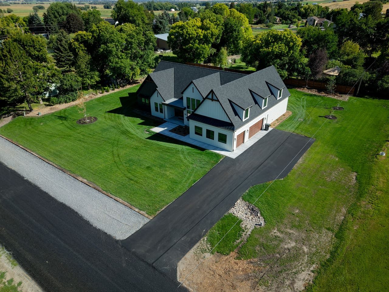 Aerial view of an active J&C Asphalt job site in Mendon