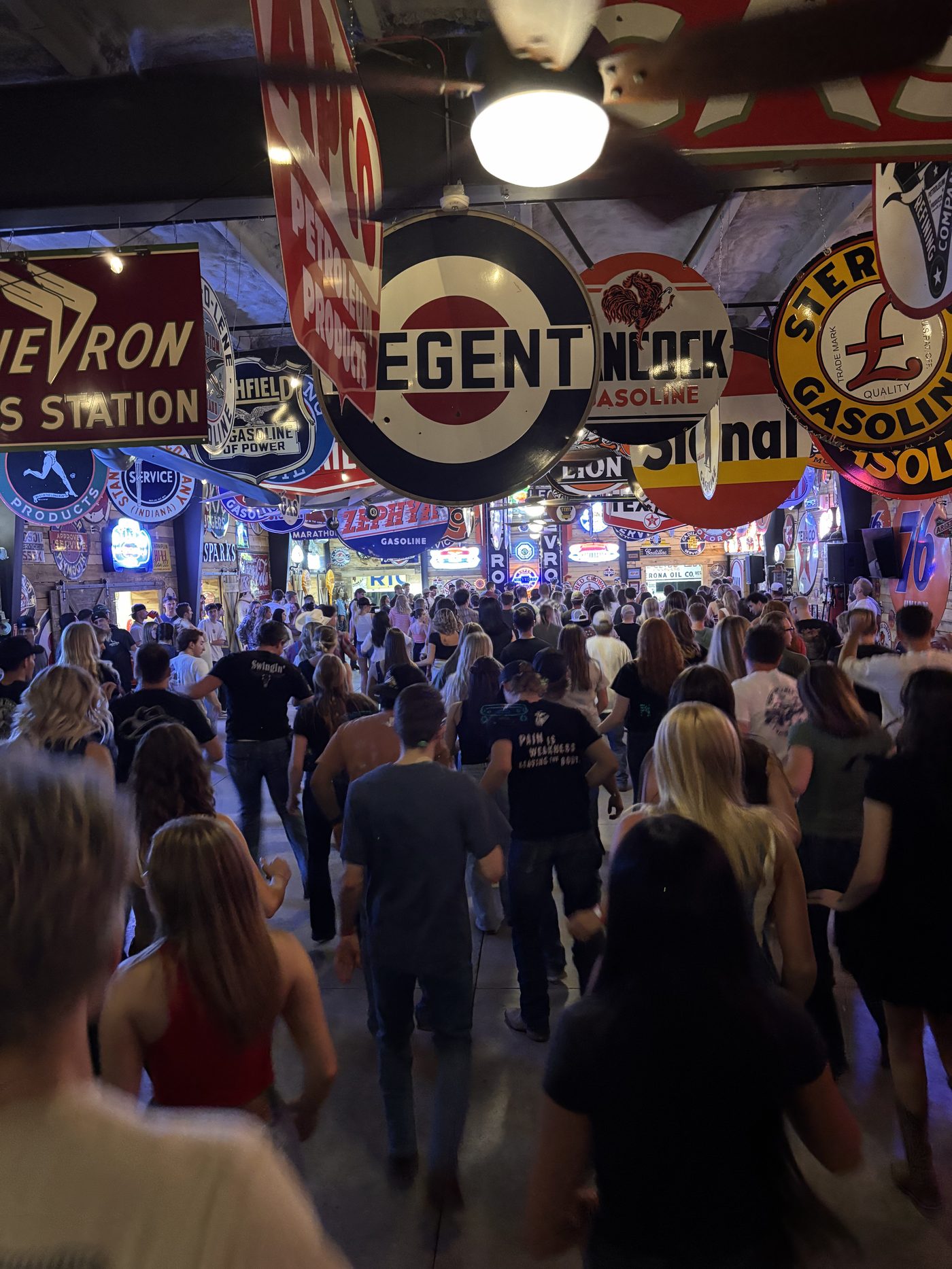 A packed crowd dancing at a Swingin Dance Co event