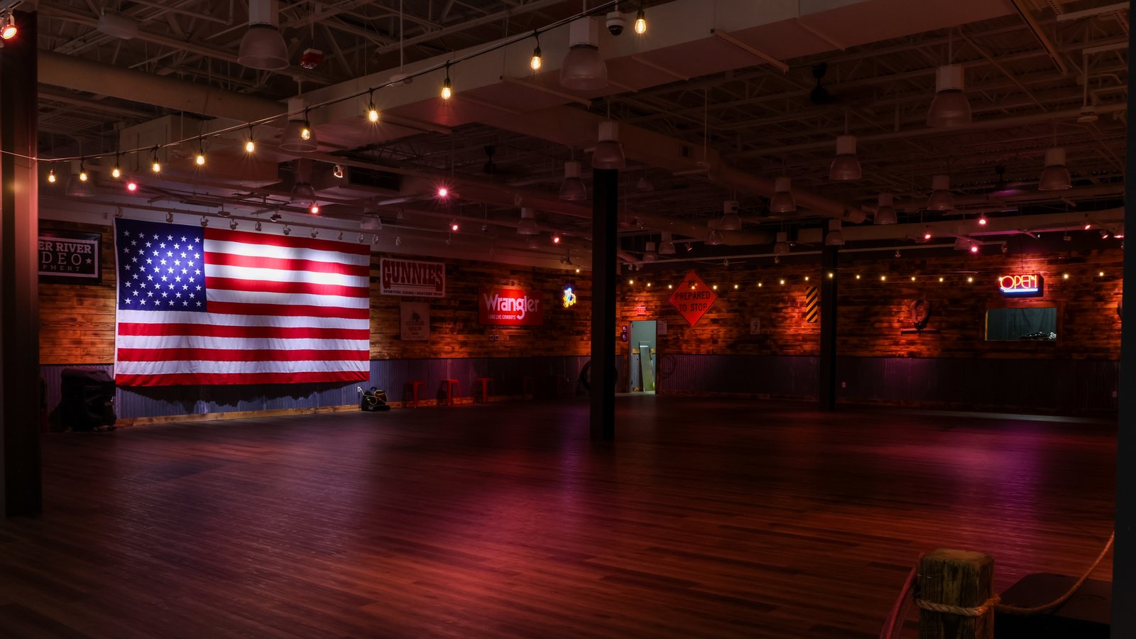 The Swingin Dance Co venue interior with an American flag on the wall